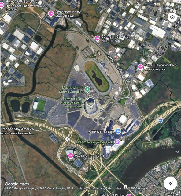 A satellite image of the stadium and environs - it is surrounded by a sprawling network of highways cutting it off from even the closest hotels.