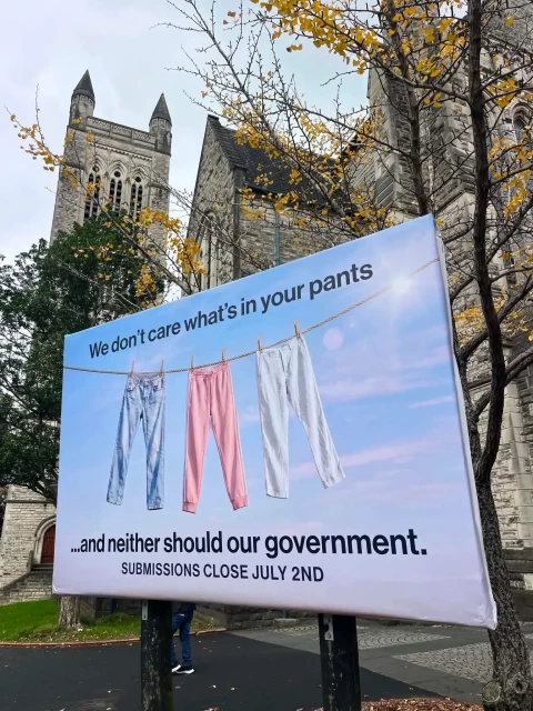 A sign "We don't care what's in your pants... and neither should our government."