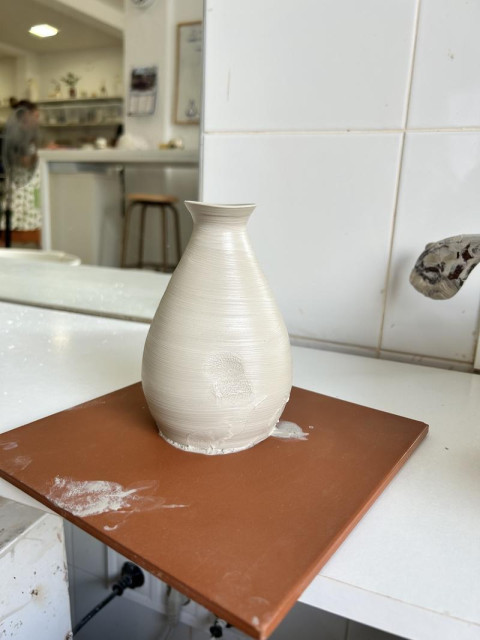 Raw pottery sake bottle