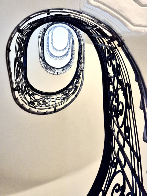 Staircase of a 19th century building seen from below in the josefstadt, vienna, austria