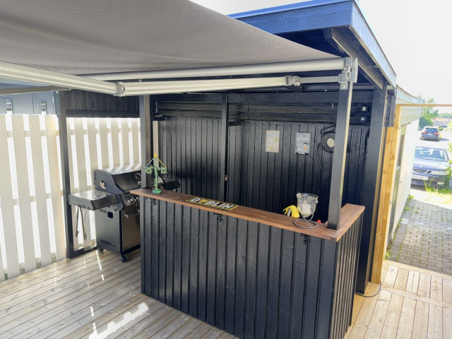 My new outdoor kitchen/bar taken on a sunny midsummers eve. It is not done just yet but in good enough shape to handle guests.