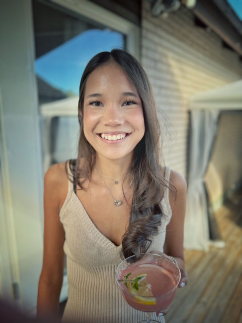 My daughter standing on the outdoor decking.
