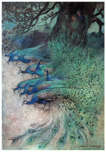 A flock of peacocks, arranged in a semicircle, pecks at the ground as two women watch them from within the hollowed trunk of a large tree.