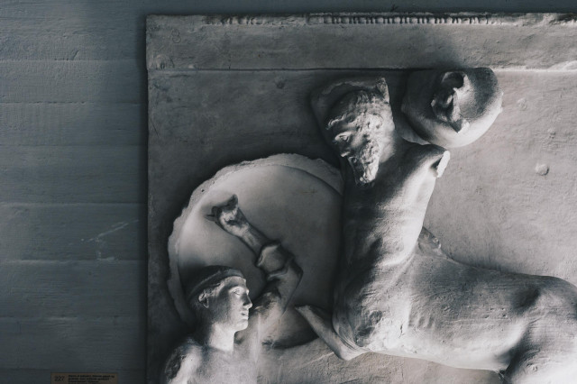Bas-relief of a man fighting a centaur.