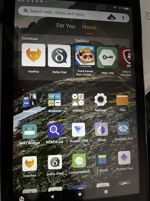 Photo of Kindle Fire Tablet with a bunch of open source apps on the landing page, in addition to standard Amazon ad-ware and apps.