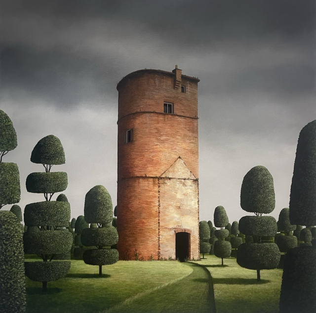 A cut grass path leads to a slender brick tower stands within a topiary garden.