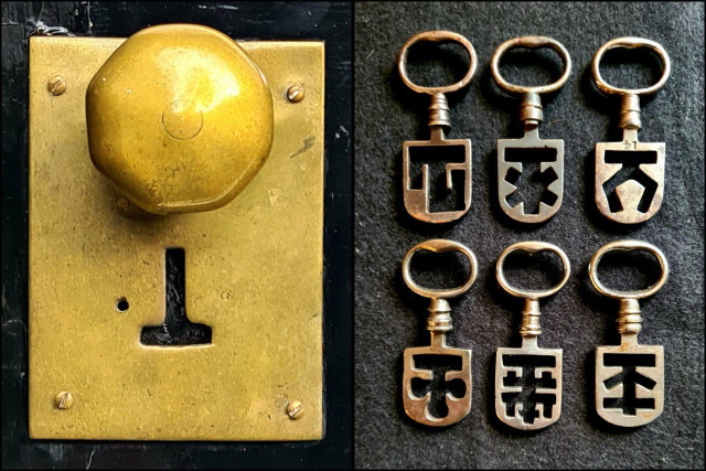 A t-shaped keyhole of a surviving Victorian Odell Night Latch and a selection of Odell Night Latch keys.