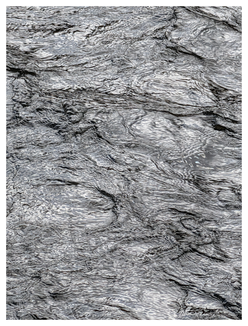 time exposure. abstract gray, silver and black. swirls on the surface of a fast-moving mirror.