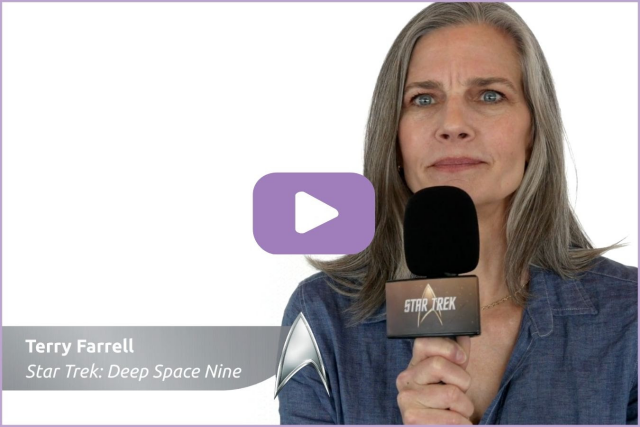 Photo of Terry Farrell from Star Trek: Deep Space Nine holding a microphone