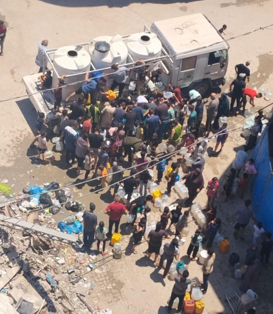 We stand in long lines for hours just to get water here in Gaza. 💧💔