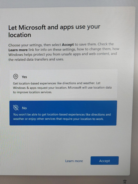 photo of the Windows 11 post-install screen saying
"Let microslop and apps use your location" with the options Yes, No, and two buttons at the bottom "learn more" and "Accept"