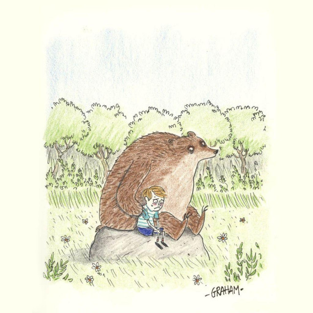 A child leans against a large bear on a rock, both looking sad but comforted as they sit together in a grassy meadow with trees in the background.