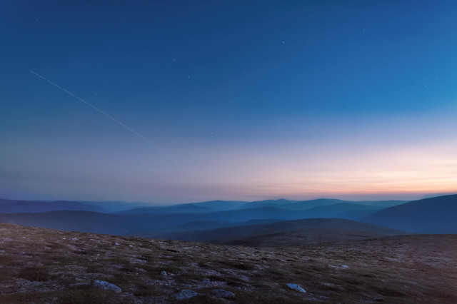 An image of ISS Flypast at sunset on a mountain top. Càrn na Drochaide. The Cairngorms NP, Scotland