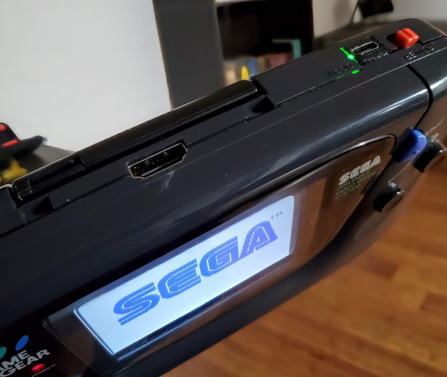 The top of my Game Gear showing the HDMI port and the glowing green USB-C port