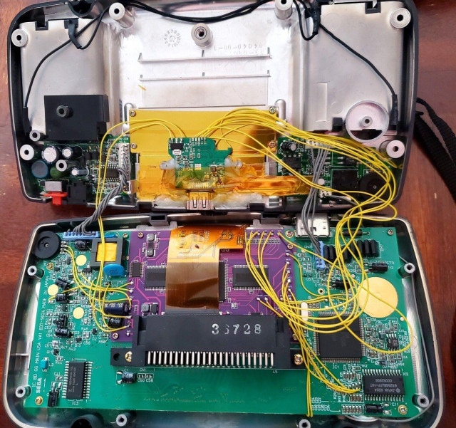 The messy, wire-filled insides of my Game Gear (just the HDMI mod, before the power mod)