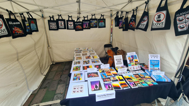 A market stall selling Glasgow-themed goodies.