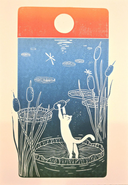 Linocut print of a cat on a lake at sunset