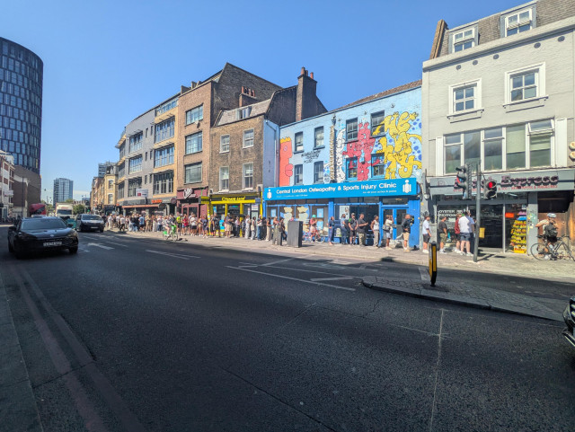 A giant queue in front of a newsagent's in Old Street, Hackney, London.