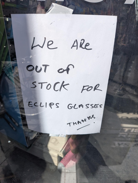 A hand-lettered sign in a newsagent's window

We are out of stock for eclips (sic) glasses

Thanks