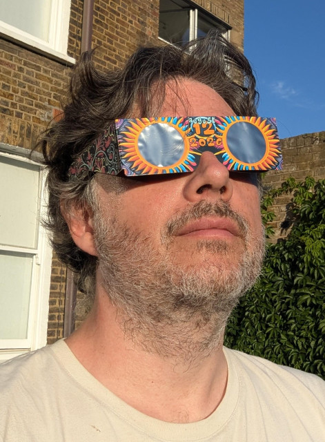 Dan wearing eclipse glasses