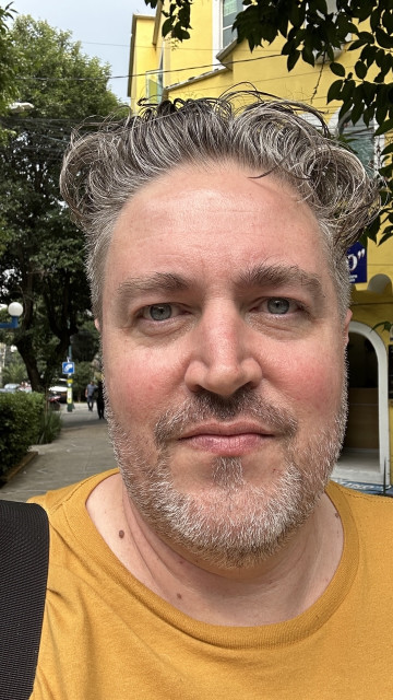 After haircut. Beard is close, basically just stubble. Hair is wet and slicked up/back. It won't stay that way, would require a jar of pomade! Some random curling is already happening.