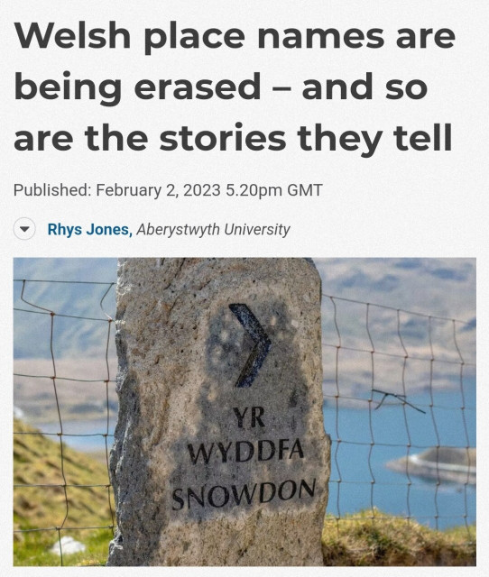 News article titled "Welsh place names are being erased, and so are the stories they tell"
Picture is of a stone waymarker with  "Yr Wyddfa Snowdon" on it